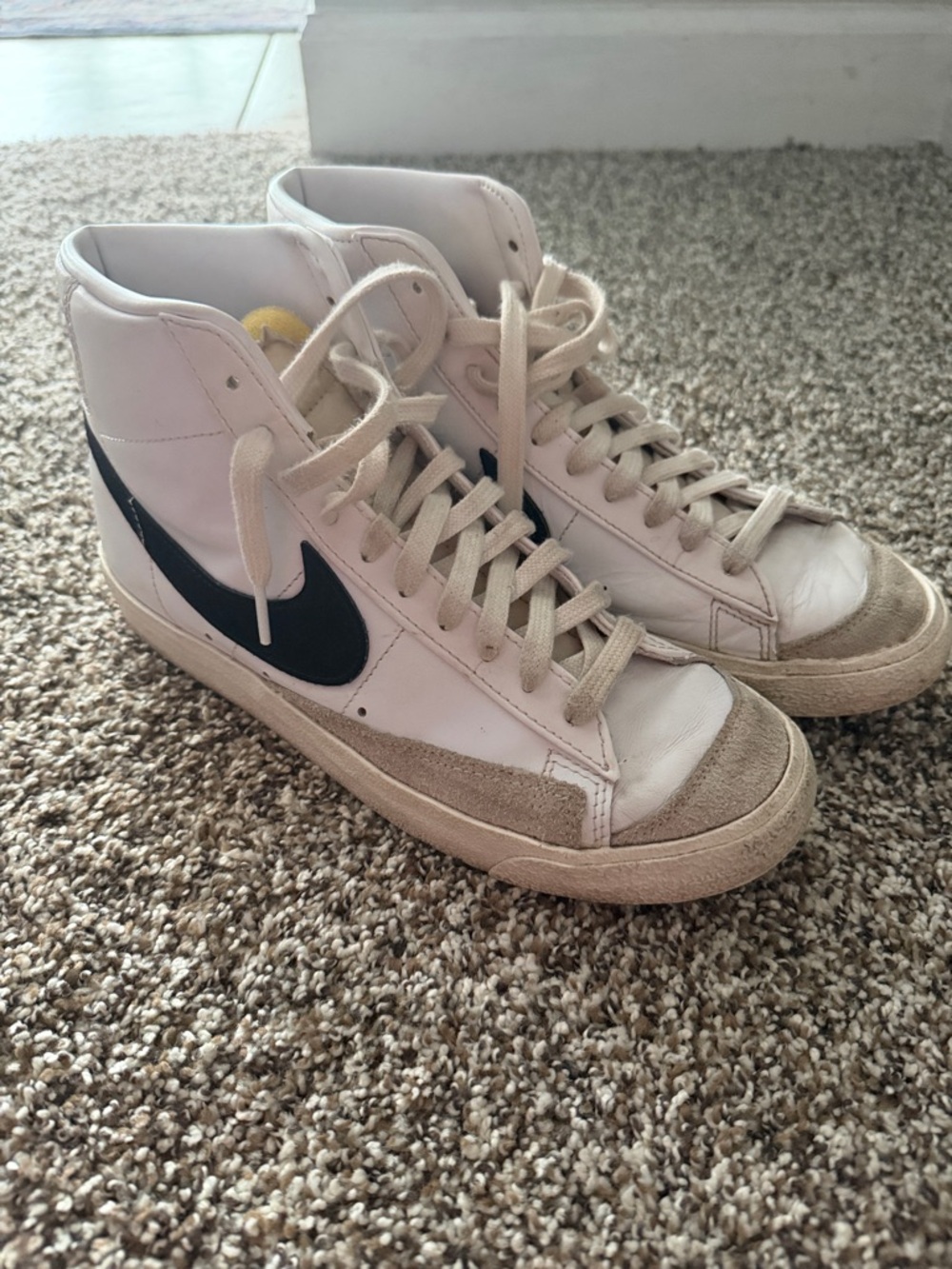 Nike White High-Top Sneakers with Black Swoosh